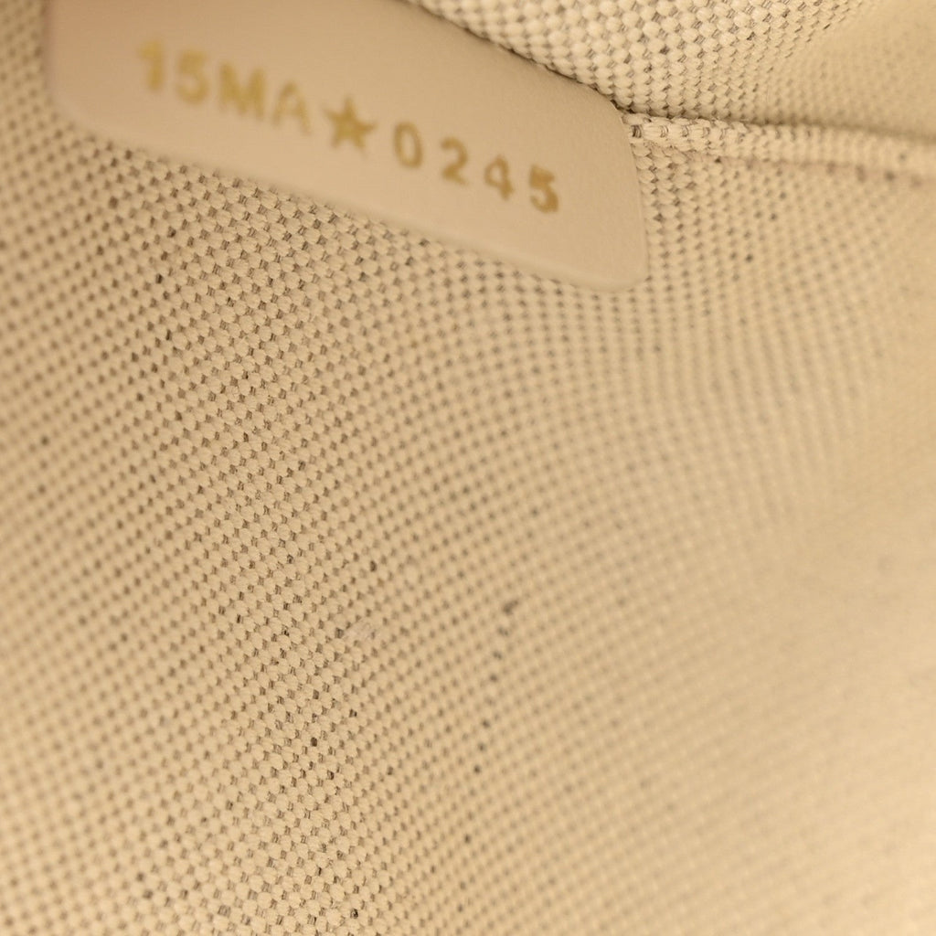 Oblique Calfskin Medium Signature Bucket Bag Beige